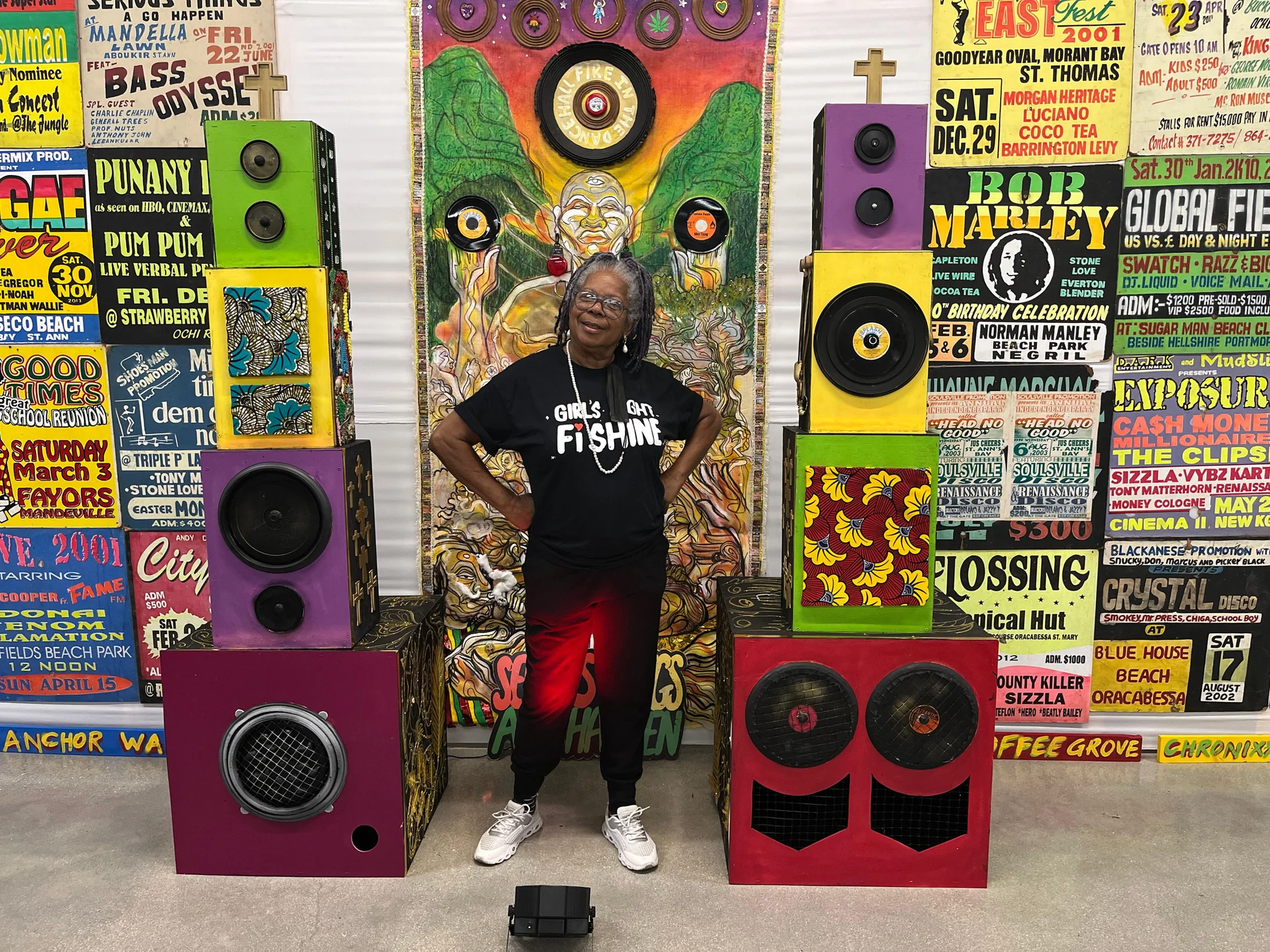 A wall of colourful hand-painted Jamaican dancehall signs